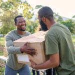 black man charity and holding box in park of dona 2023 02 07 21 57 49 utc cropped